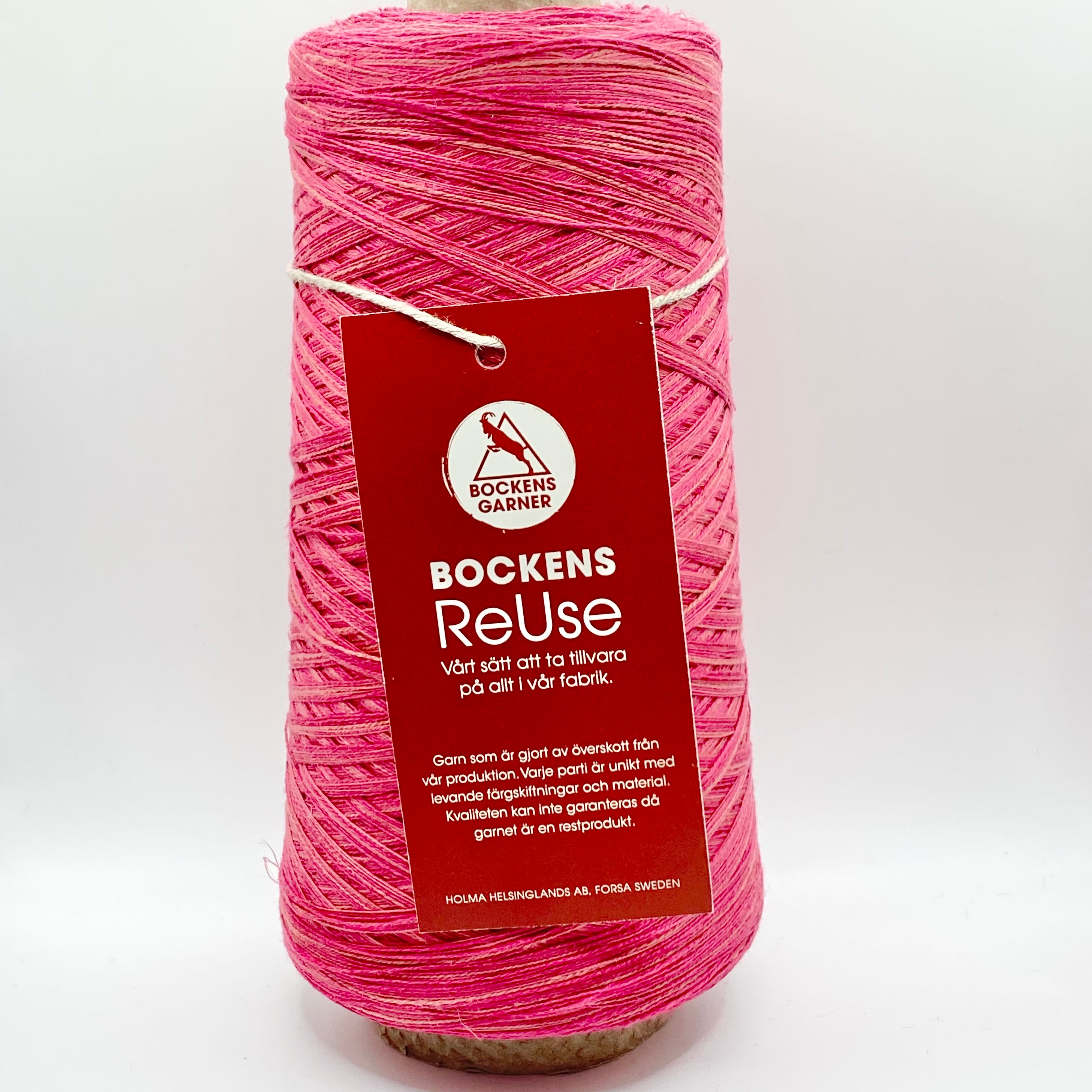 Cone of Bockens Garner ReUse yarn. Pink.