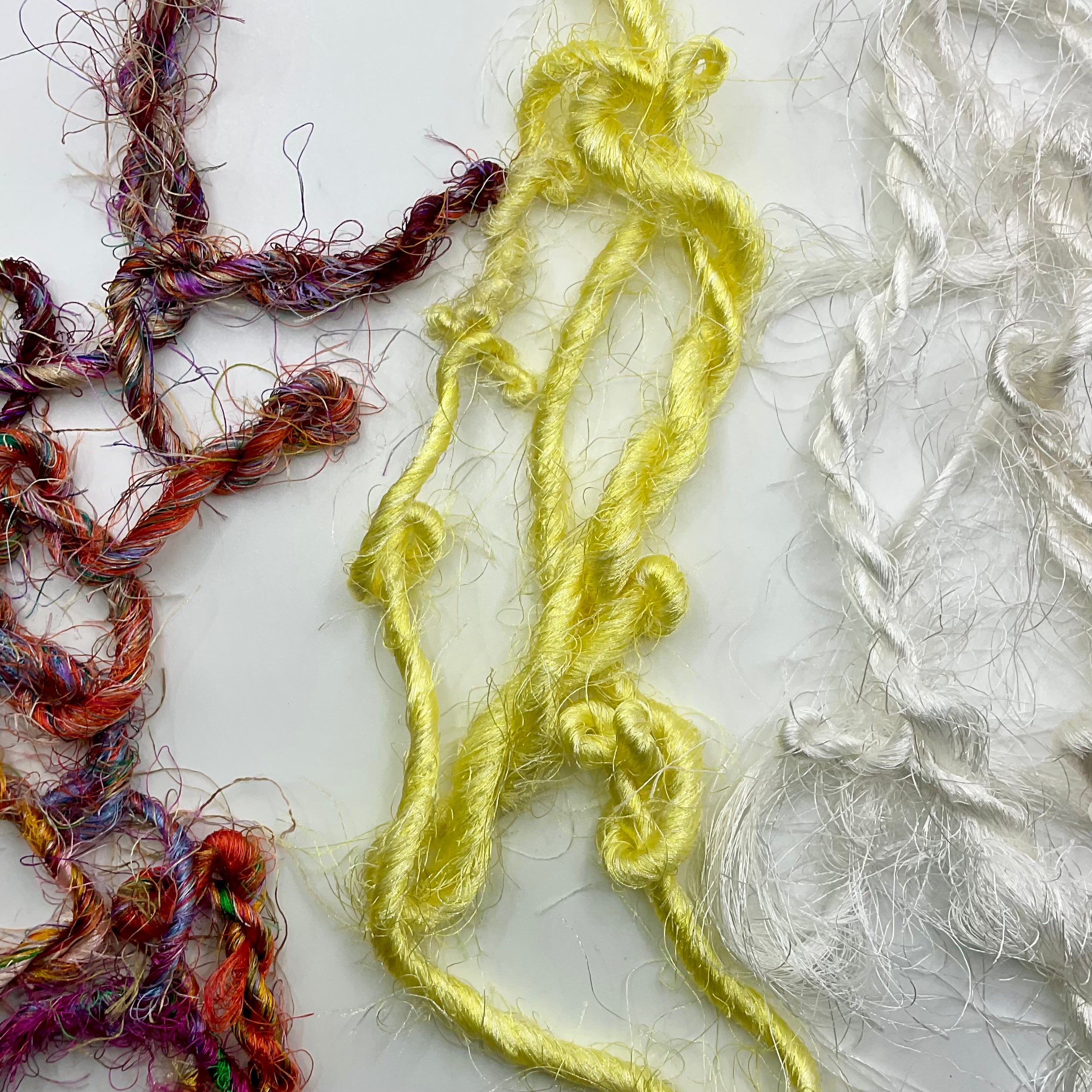 Brightly coloured hand Spun polyester yarn - Helps reduce waste.