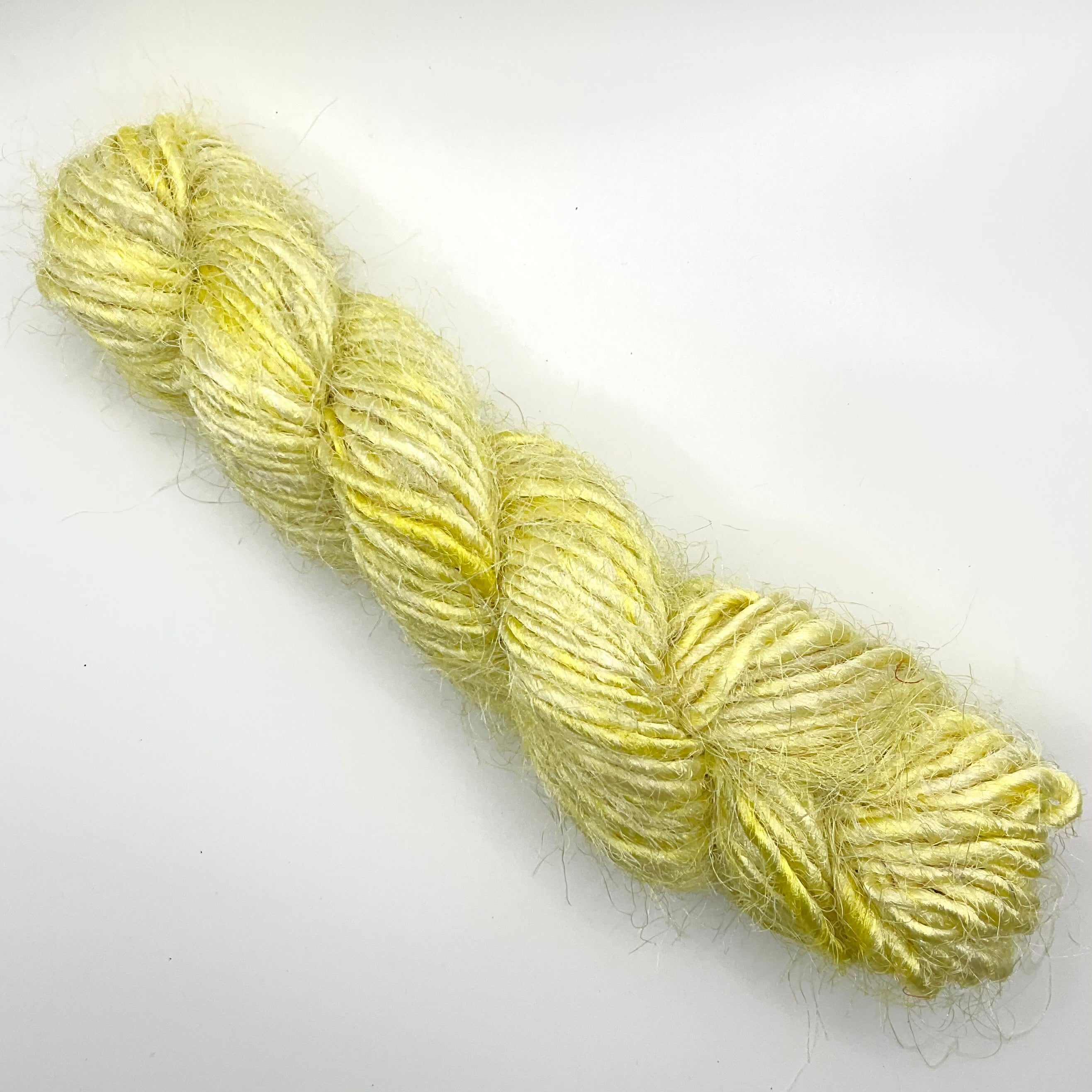 Yellow polyester yarn from India - Helps reduce textile industry waste.
