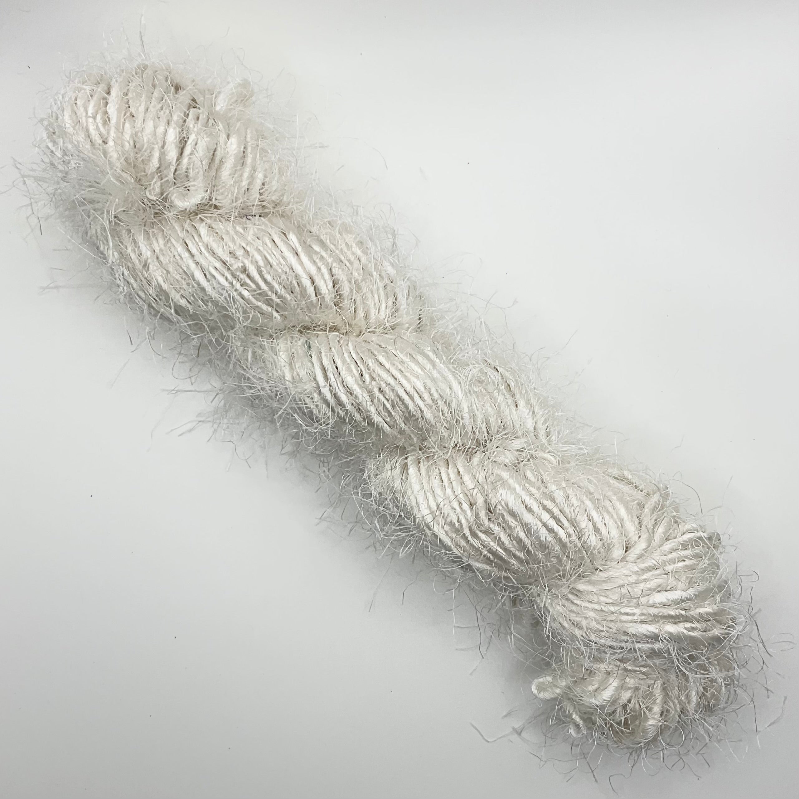 White handspun polyester yarn from India - Helps reduce waste.
